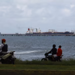 The Guinea-flagged oil tanker MT Bandra, which is under sanctions, is partially seen alongside another vessel at El Palito terminal, near Puerto Cabello, Venezuela December 29, 2025. REUTERS/Juan Carlos Hernandez (US oil investment Venezuela)